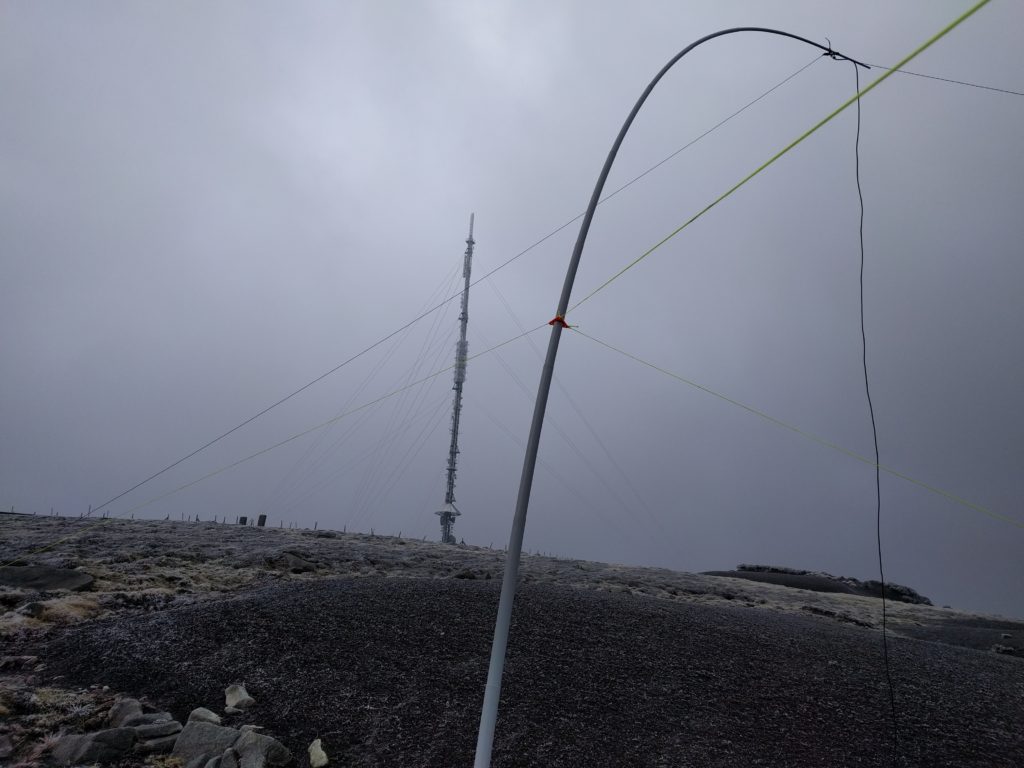 My fibreglass pole with wire antenna in the foreground, main transmitter mast in the background