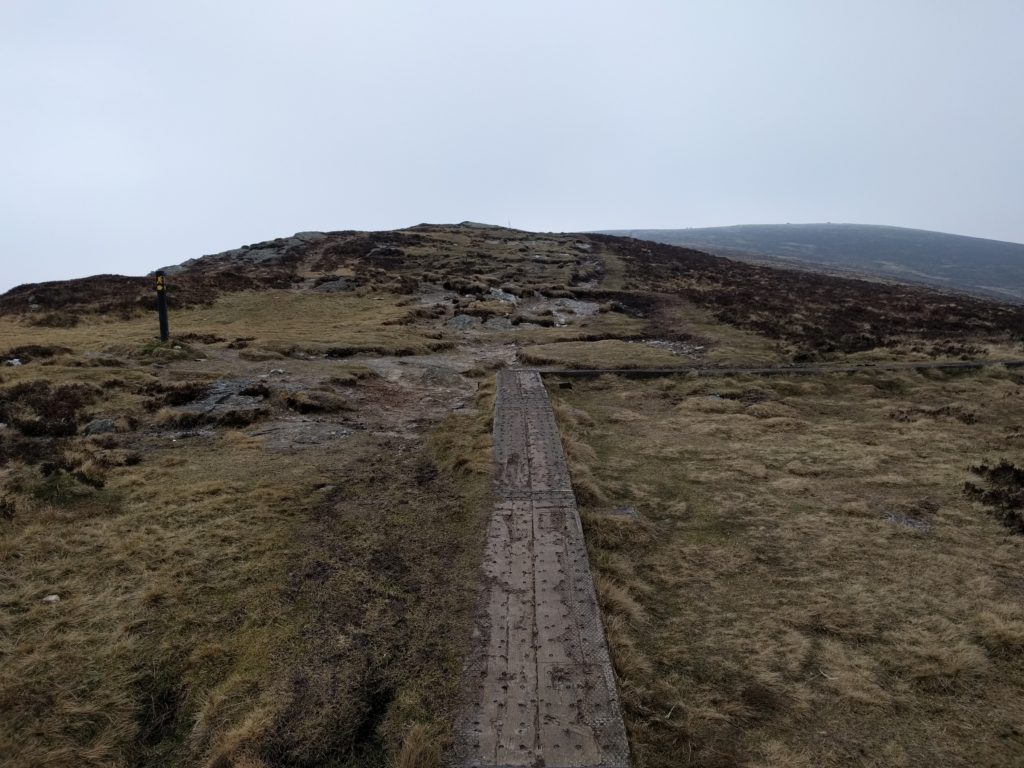 Boardwalk turns right, hill ahead