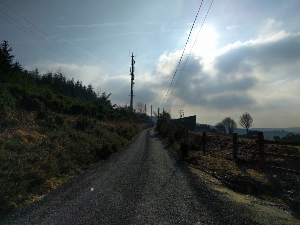 Road with a transmitter mast in the distance