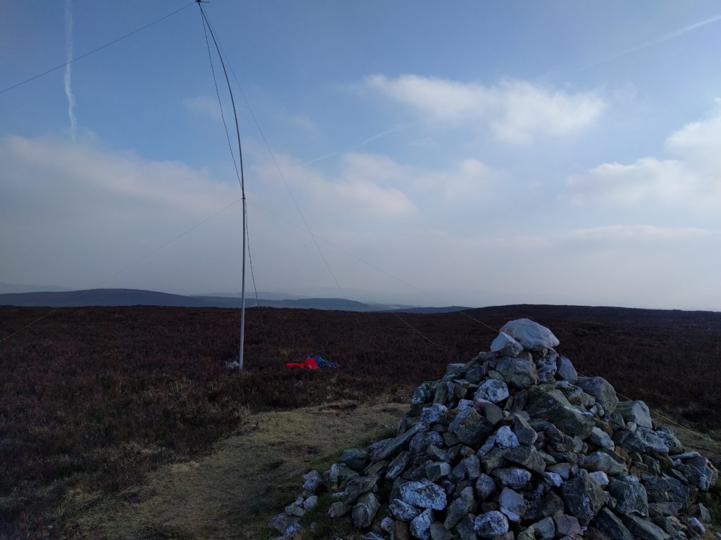 Cairn in foreground, mast in surrounding heather