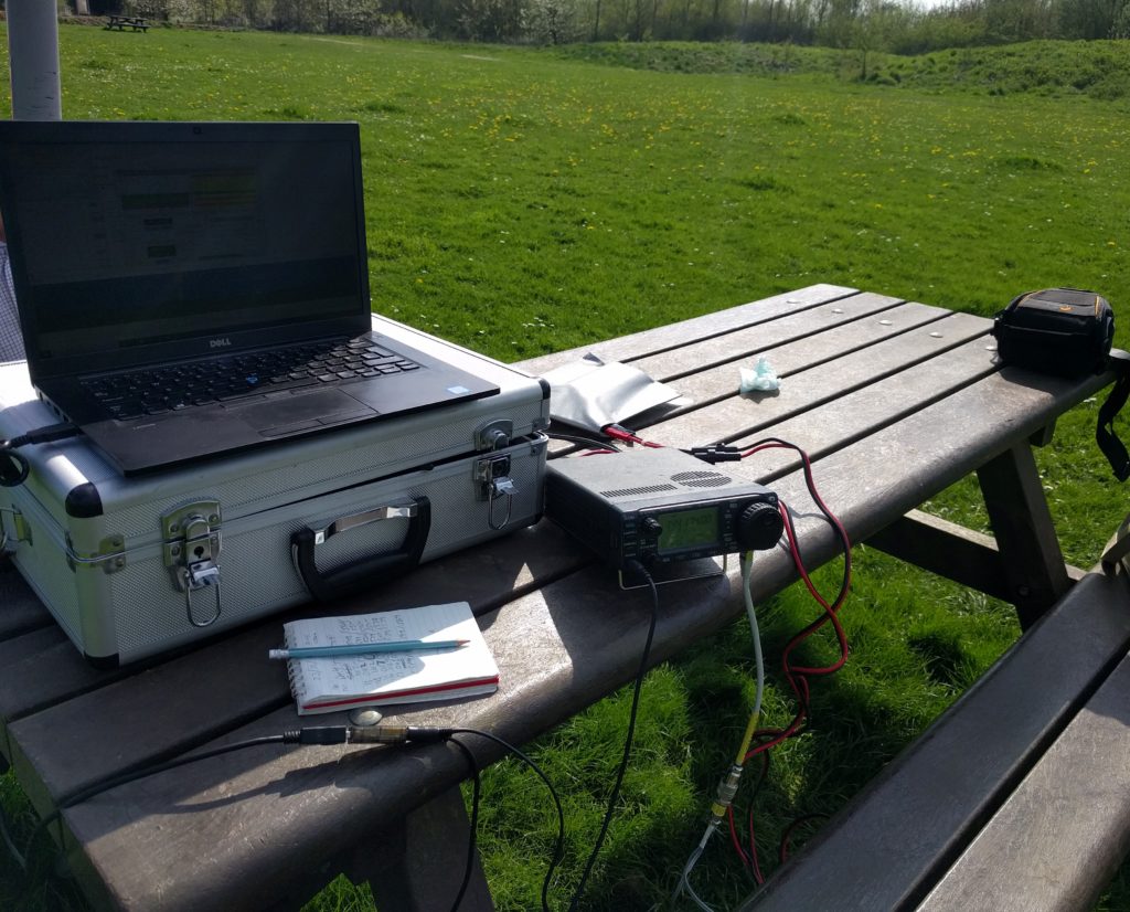 Park bench with radio equipment on top