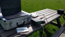 Park bench with radio equipment on top