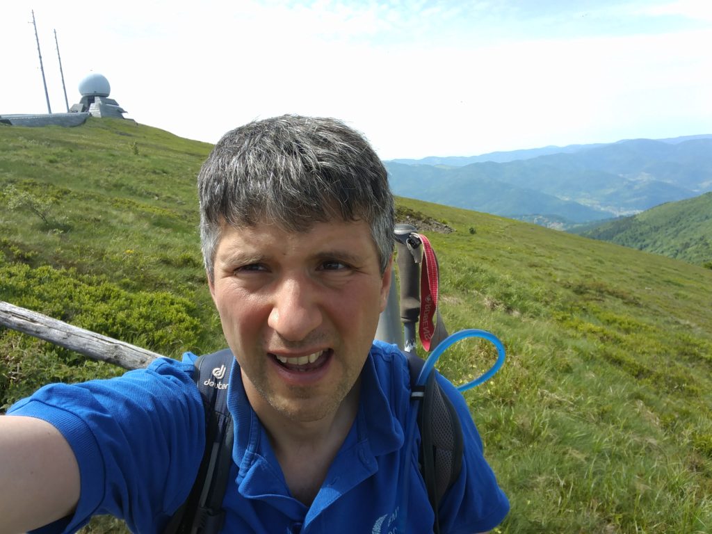 Me at the summit, with the 'golf ball' raydome in the background