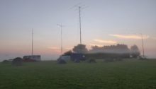 Mist hanging over a field with tents