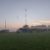 Mist hanging over a field with tents