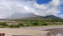 Volcano with abandoned houses in foreground